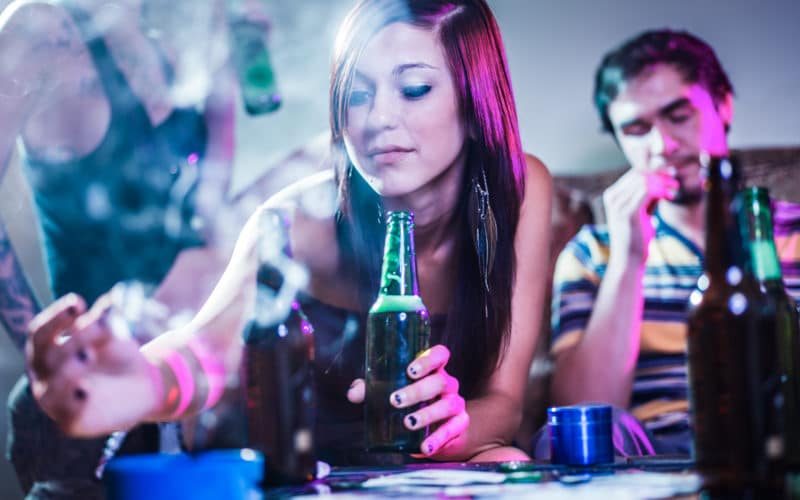 Girl,putting,joint,in,ashtray,at,crazy,party